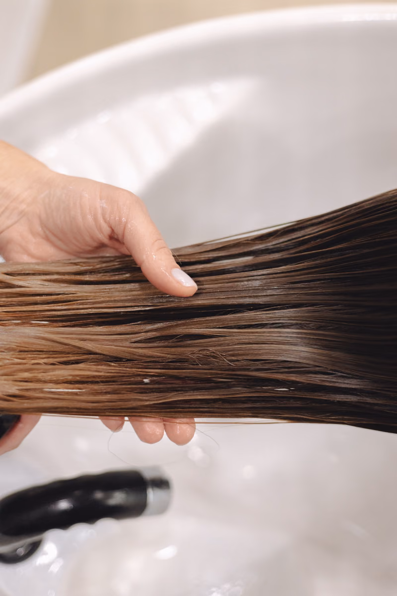 A section of freshly smoothed hair held flat
